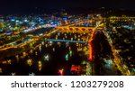 Aerial view of Jinju Namgang Yudeung Festival in Jinju city at night, South korea. Scenery consist of many lanterns there are floating in the river. 