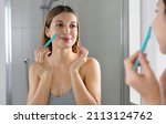 Beauty woman shaving her face...