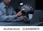 Small photo of A Businessman hand touching Virtual reality man with symbol neurons in the brain. Concept of idea and innovation, digital business concept. work from home.