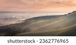 Misty morning on the escarpment of Firle beacon on the south downs in East Sussex south east England UK