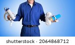 Small photo of Detail of water treatment technician parts and reverse osmosis supply tools in hands with blue isolated background. Front view.