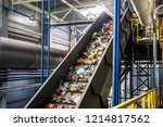 moving conveyor transporter on Modern waste recycling processing plant. Separate and sorting garbage collection. Recycling and storage of waste for further disposal. 
