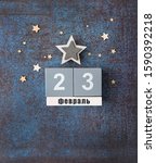 Small photo of February 23 Holiday. date calendar, stars on dark blue background. Fatherland defender men's day greeting card. copy space