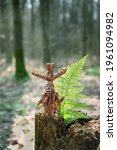 Small photo of magic witchcraft doll made of tree bast in forest natural background. Forest grandmother, defender guardian spirit of nature. ancient pagan, Wiccan, Slavic traditions. esoteric spiritual ritual