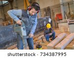 Construction Worker Using...