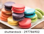 Macaron in plate on wood table