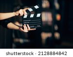 Hands Holding a Film Slate Directing a Movie Scene. Cinematography film-making conceptual image in between takes