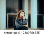 Small photo of Unhappy Woman Making Facepalm Gesture Waiting Outside. Stressed person having a breakdown regret crisis
