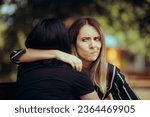 Small photo of Woman Hugs Fake Friend Making Faces Behind her Back Backstabbing toxic girlfriend embracing someone with bad intentions