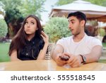 Small photo of Couple Arguing on a Date at a Restaurant - Annoyed girlfriend listening to her boyfriend reproaches