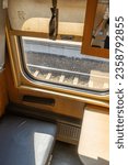Small photo of Recumbent seat compartment in the old train Warsaw - Kyiv. View from inside Ukrainian high speed train.