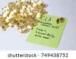 Small photo of omega 6: conjugated linoleic acid (CLA) in capsules on the white background