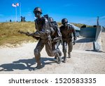 Small photo of Normandy, France - June 2019: 75th Anniversary of the D-Day landings. Memorial to the Andrew Jackson Higgins and the Higgins landing craft, near Utah Beach, Normandy