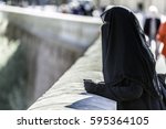 Small photo of The niqab, is a long tunic that covers completely the body and the head. Scarcely it leaves to the overdraft the eyes of the woman.