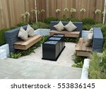 A lifestyle garden combining outdoor and indoor living with seating area