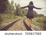 Girl Balancing On Train Rails 
