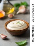 Small photo of Bowl of Homemade mayonnaise sauce with ingredients and herbs for cooking