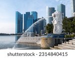 Small photo of Singapore - 22 October 2022: Merlion Statue at Merlion Park, it is a mythical creature with a lion's head and the body of a fish. It is used as a mascot and national personification of Singapore