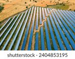 Small photo of Solar farm with photovoltaic panels converting solar power to electricity for green energy