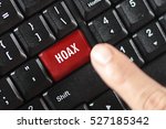 hoax word on red keyboard button
