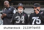 Small photo of Oakland, California - February 14, 2022: Diehard Oakland fans in full Raiders gear before the start of "One More Monday Night in Oakland: A Celebration of John Madden."