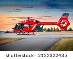 Red color helicopter. Great photo on the theme of air medical service, air transportation,  air ambulance,  fast city transportation or helicopter tours. 