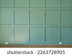 Small photo of Green Accent Wall in Home Office with Wood Slat Pattern