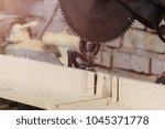 Small photo of Workshop of Cabinetmaker Carpenter - Working with Wood. Electric Backsaw with Copyspace.