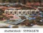 cashflow - cube with letters, money sector terms - sign with wooden cubes