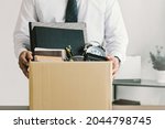 Small photo of Resignation. businessmen holding boxes for personal belongings and resignation letters.Quitting a job,The big quit.The great Resignation.