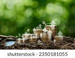Small photo of Investment Ideas and Business Growth. Coins stacked on the ground with a digital graph. Green business growth. Finance sustainable development. Investing in renewable energy is crucial for the future.