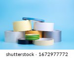 Many different kind of scotch tapes on a blue background.	
