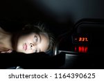 Young girl using smartphone in bed late at night