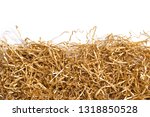 Golden shredded paper for gifting, shipping and stuffing on white background. Top view.