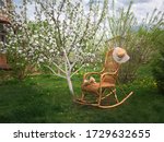 Wicker Rocking Chair With Book...