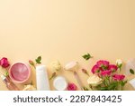 Stylish beauty ritual concept. Top view flat lay of trendy serum pump bottles, tube, jade roller, and rose flowers on a pastel beige background with an empty space for copyspace or branding