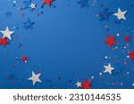 Experience the joy of Independence Day with this top-down view: glimmering stars and confetti, artfully arranged on a blue surface with a blank circle for text or promotion