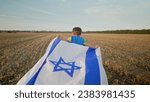 Small photo of Happy Israeli Jewish little cute boy running with Israel national flag. Independence Day. Patriotism. High quality photo