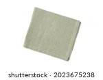 Linen green folded textile napkin isolated on white background. Natural cloth serviette for  dishcloth.  Top view
