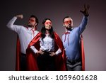 super businesspeople in masks and capes showing superpower isolated on grey