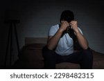 Small photo of depressed man with insomnia struggling from post traumatic stress disorder