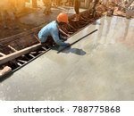 Man Hand Spreading Concrete Mix ...