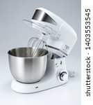 Small photo of A mixer, hand mixer or stand mixer, is a kitchen device that uses a gear-driven mechanism to rotate a set of "beaters" in a bowl containing the food or liquids to be prepared by mixing them.