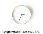 Round clock isolated on white background. Minimal concept. Flat lay. Top view.