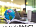 World globe on text book.
Graduate study abroad programs.    
International education school Concept. 