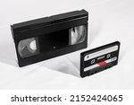 Small photo of Old audio cassettes and VHS videocassette on a white background