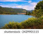 Small photo of Dexter Reservoir with Lowell Covered Bridge, Oregon, surrounded by lush forest. Dexter Reservoir, also known as Dexter Lake, is a reservoir in Lane County formed on the Middle Fork Willamette River.