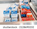 Small photo of Naples, USA - August 6, 2021: IHG Staybridge Suites hotel morning buffet continental breakfast with small individual portion packaged brand with Wholesome Farms reduced fat milk