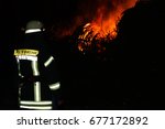 Small photo of A northern german holyday called "Biikebrennen" or "Osterfeuer". For security are always firefighter "Feuerwehr" at the place of the event.