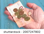 hand holding 10 euro bill and... | Shutterstock . vector #2007247802